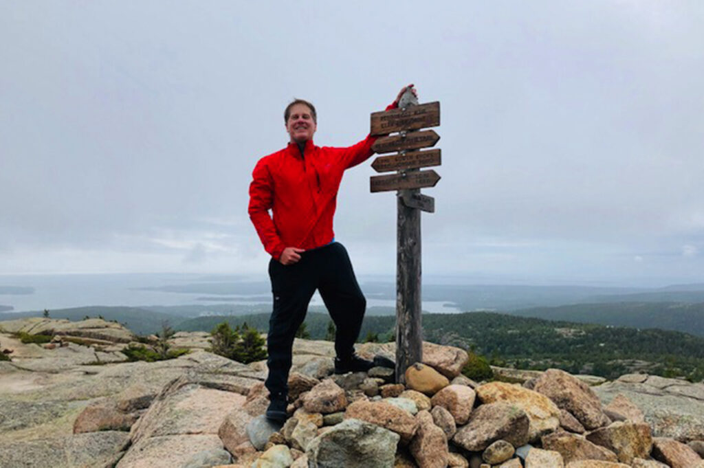 Peter Hinman at Summit of Peubscot Mountain Acadia National Park